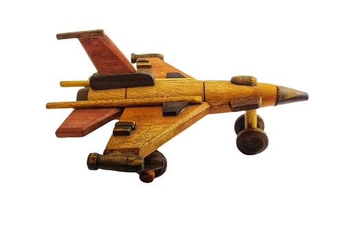 wooden military miniature toy airplane. wooden toy on white background. miniature wooden fighter jets on white background