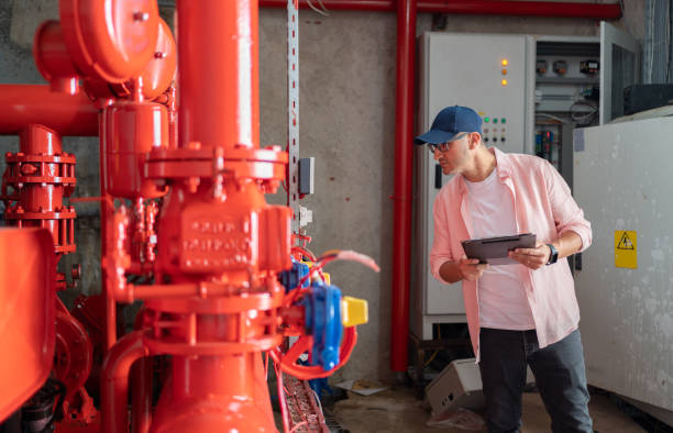 istock Male Technician At Work In Boiler Room 1816631308