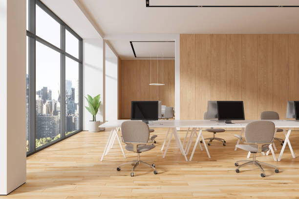 istock White and wooden open space office and board room 1816634616
