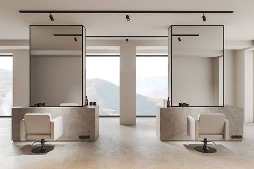 Luxury salon interior with spinning armchairs and mirror, light granite floor. Stone dresser with accessories and leather seats in row, panoramic window on countryside. 3D rendering