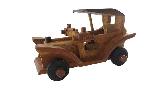 wooden toy retro car isolated on white background. Toy car made of wood on isolated white background