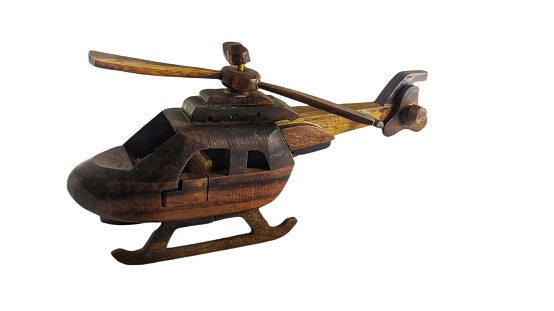 Wooden helicopter toy isolated on white background. Wooden helicopter toy