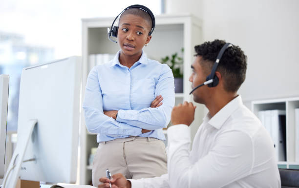istock Woman, headset and arms crossed for problem in office with training, onboarding and call centre dashboard. Female manager, employee and annoyed face for discussion, talk or conversation in workplace 1816641188