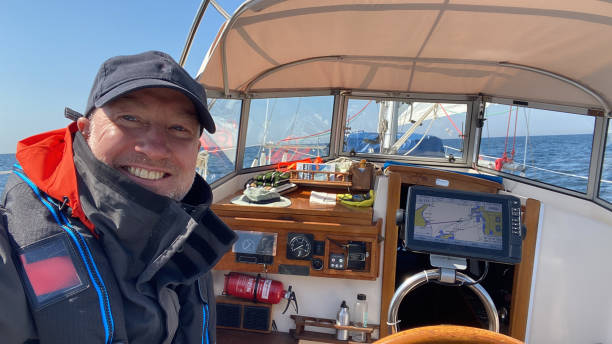 istock Happy man in his sailboat 1816665894