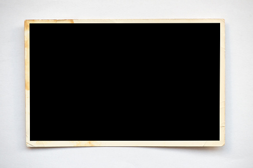 Blank retro photo frame on white.