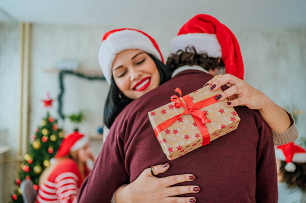 istock Friends exchanging gifts for Christmas 1816691470