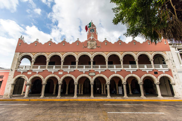 The Merida City Hall, or Palacio Municipal de Mérida, is a distinguished architectural gem that graces the heart of Mérida, the capital of Yucatán, Mexico. This historic municipal building showcases an elegant blend of neoclassical design, featuring stately columns and intricate detailing on its façade. As a symbol of both administrative function and cultural significance, the City Hall stands as a testament to Mérida's rich history and vibrant community life. Beyond its administrative role, the City Hall often serves as a venue for cultural events, exhibitions, and community gatherings, contributing to the lively atmosphere of the city center. Its central location makes it a prominent landmark, inviting residents and visitors to appreciate not only its architectural grandeur but also the dynamic pulse of Mérida's civic and cultural life.
