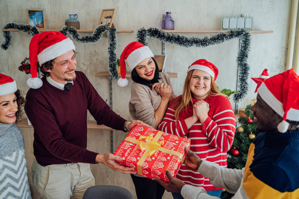 istock Friends exchanging gifts for New Year 1816695218
