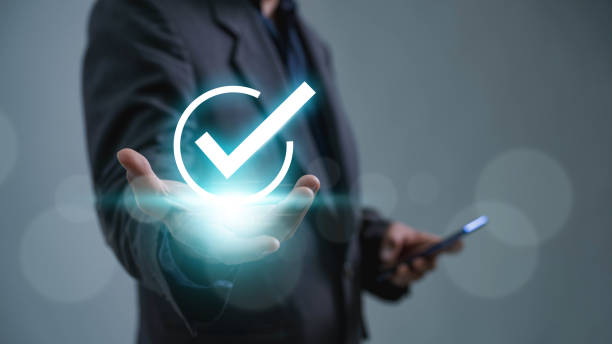istock A businessman is shown checking the appropriate boxes in the quality document control checklist, document approval, and business approve project idea checkboxes virtually 1816699572