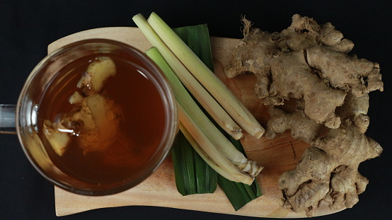 wedang jahe or ginger drink is traditional drink from Indonesia. Dark background