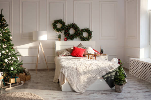 istock Bed with New Year's decorations. New Year's interior. Christmas tree 1816717954