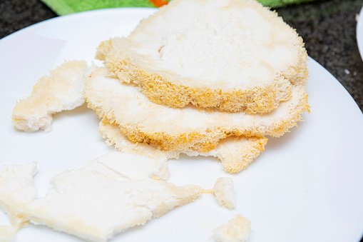 Hericium erinaceus (also called lion's mane mushroom, mountain-priest mushroom, bearded tooth fungus, and bearded hedgehog)  coocking it in a frying pan, with egg and four.. breadin it is Delicious!!