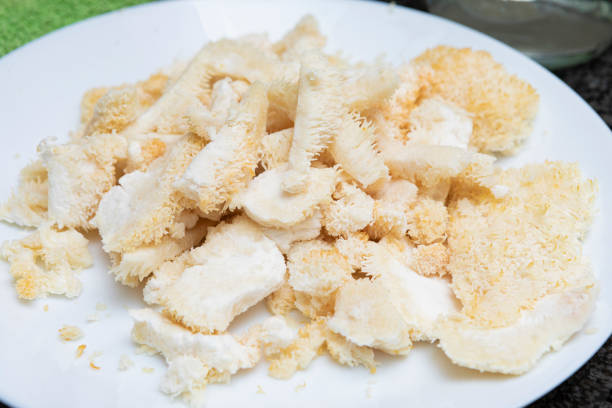 istock Hericium erinaceus (also called lion's mane mushroom) - Frying it with egg and flour 1816720390