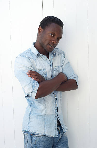 istock African american man standing outdoors with arms crossed 181672185