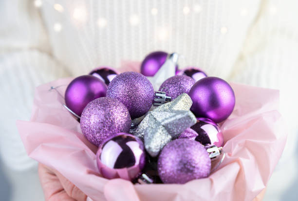 istock Women's hands hold a Christmas decorations. Close-up. Selective focus. 1816724901