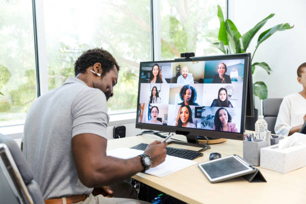 istock Male business owner leads virtual team meeting on desktop PC 1816744412