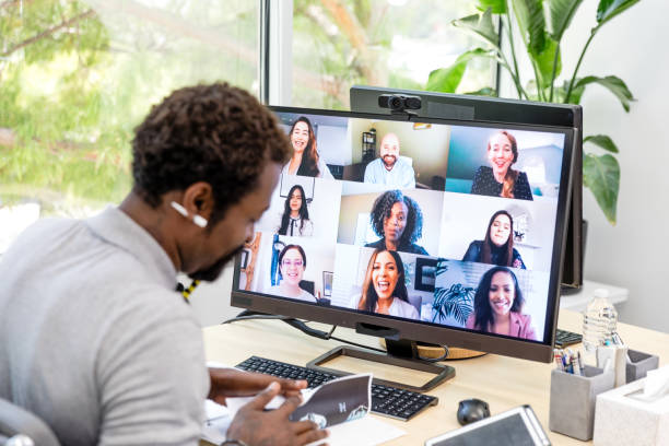 istock Male manager looks through notes during meeting with diverse employees 1816744460
