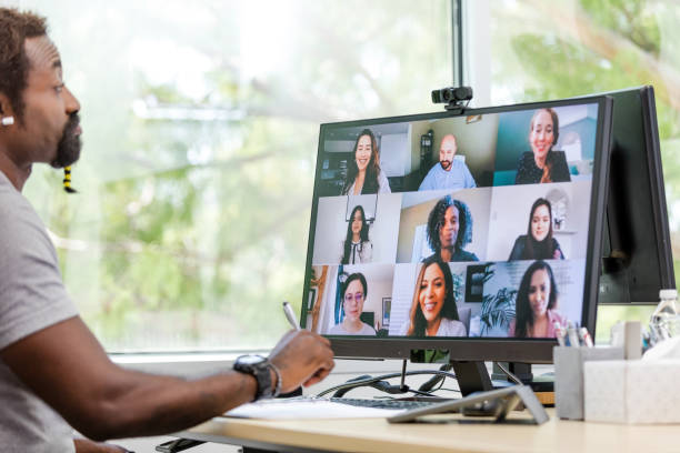 istock Businessman listens to virtual co-workers 1816744468