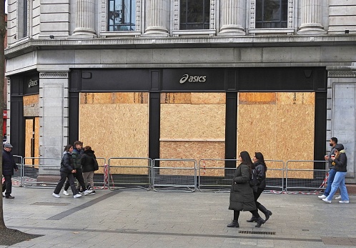 25th November 2023, Dublin, Ireland. Asics store boarded up on O'Connell Street after looting during the Dublin riot on 23rd November, following the attack on the children at Gaelscoil Colaiste Mhuire