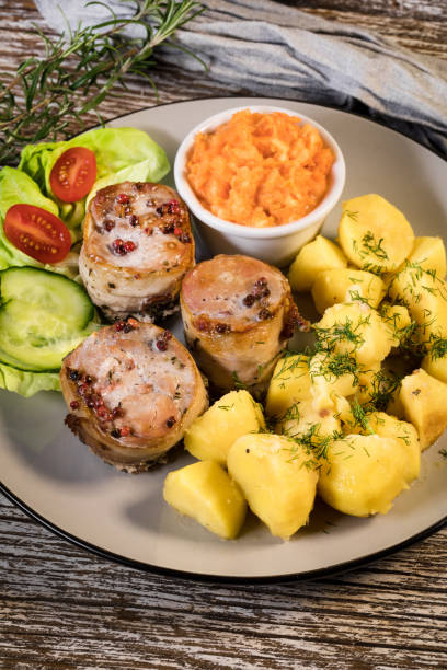 istock Pork tenderloin wrapped in bacon. 1816770454