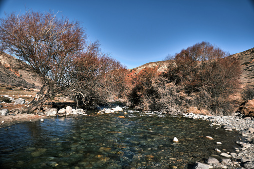 Stream in winter mountain gorge