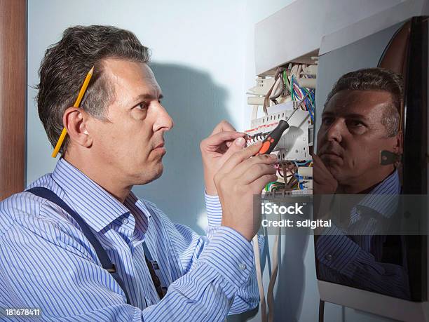 Electrician At Work Stock Photo - Download Image Now - Adult, Adults Only, Blue-collar Worker