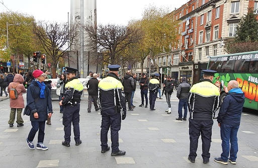25th November 2023, Dublin, Ireland. The Gardai, Irish police force, on O'Connell Street, in front of the Dublin Spires.