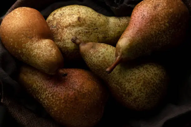 Photo of Close up of autumn pears, raw healthy dessert, agricultural production