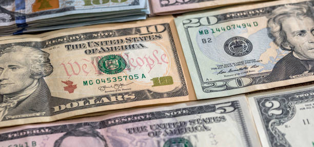istock American different paper dollar banknotes as wallpaper finance background 1816792377