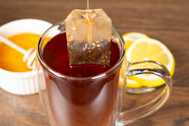 istock Preparation tea from a tea bag in a glass cup. 1816797346