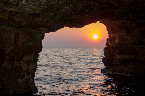 istock View of the sunset from the cave inside. No people. 1816798433