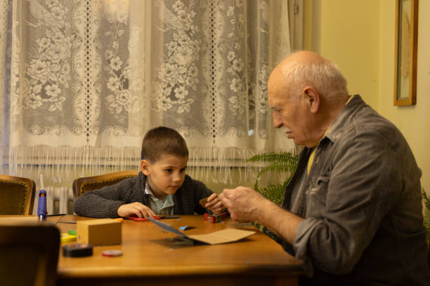 istock Grandpa helping with school project 1816813474
