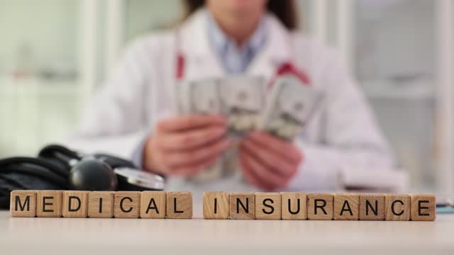 Medical bill insurance doctor counts cash dollar