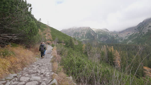 Teenagers hiking in High Tatra Mountains, Slovakia on an autumn day