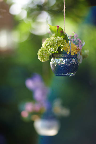 istock Beautiful spring flowers in a vase on wooden background 181684357