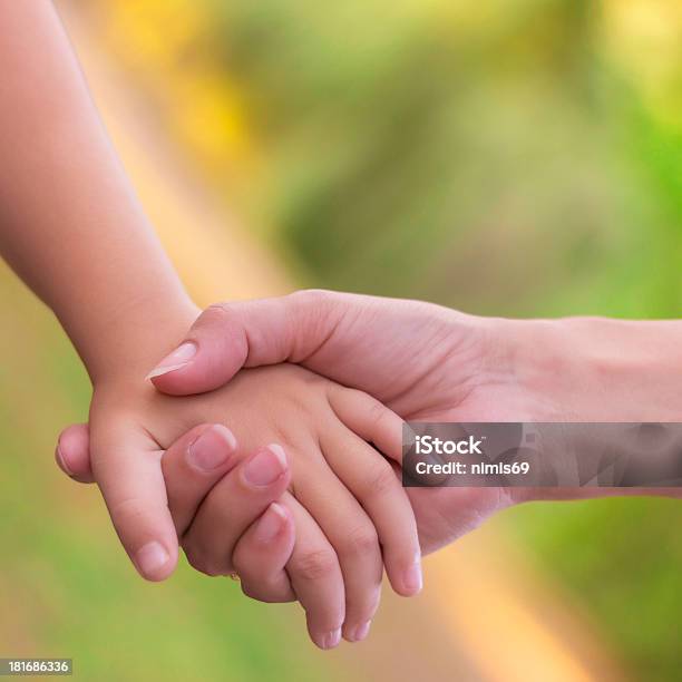 Sisters Holding Hands Stock Photo - Download Image Now - Assistance, Bonding, Care