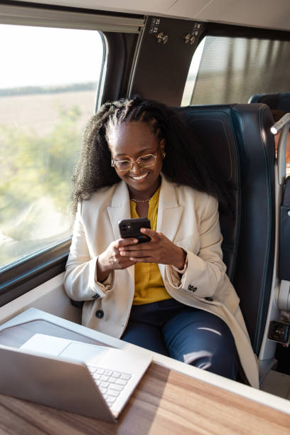 istock A young African American female freelancer enjoying her train ride, while scrolling through social media 1816902008