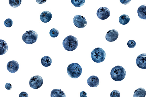 Falling blueberries isolated on white. Background of fresh blueberries. Blueberry isolated on white.