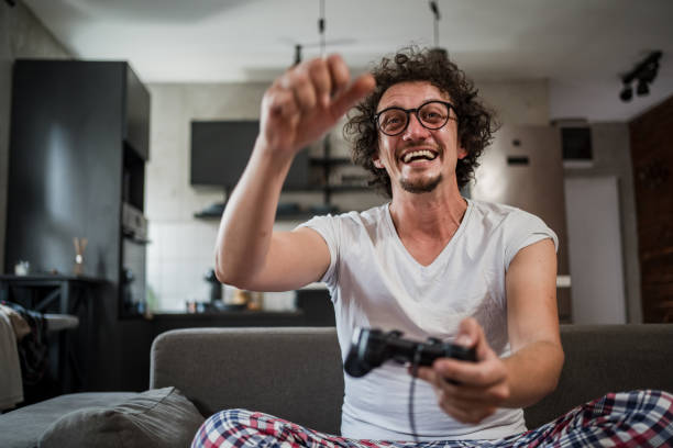 istock A young white man is having fun playing video games 1816911962