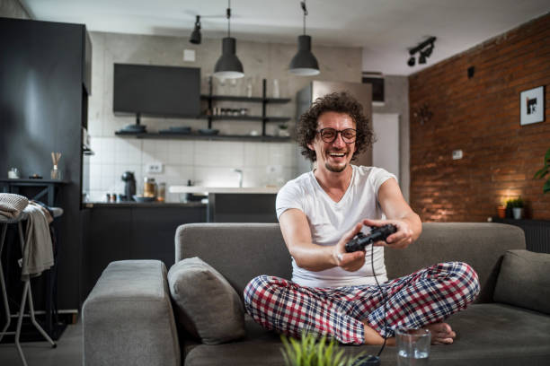 istock A young white man is having fun playing video games 1816912540