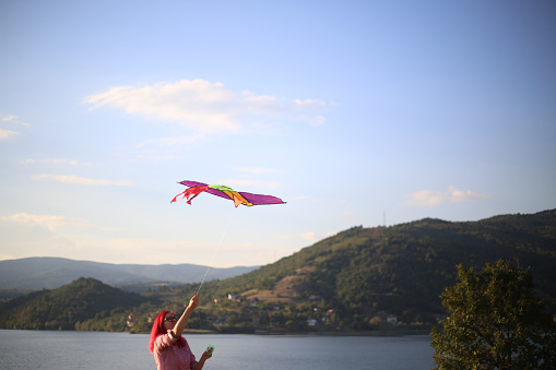 Woman flying a kite