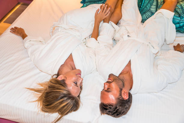 istock A couple lying on a luxury bed in a hotel 1816948611