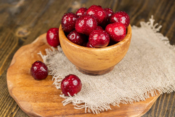 istock covered with drops of water ripe red cherries on the table 1816970549