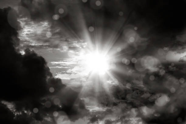 istock black and white dramatic cloudy sky with shinning sun 1816973326