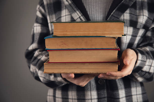 istock woman holding books in her hands 1816992173