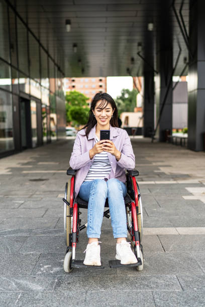 istock Casually dressed young Asian woman in wheelchair 1817001418