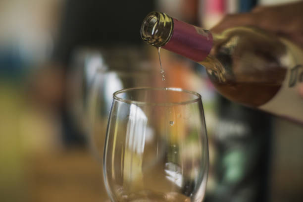 istock Waiter serving wine in crystal glasses during a tasting 1817001445