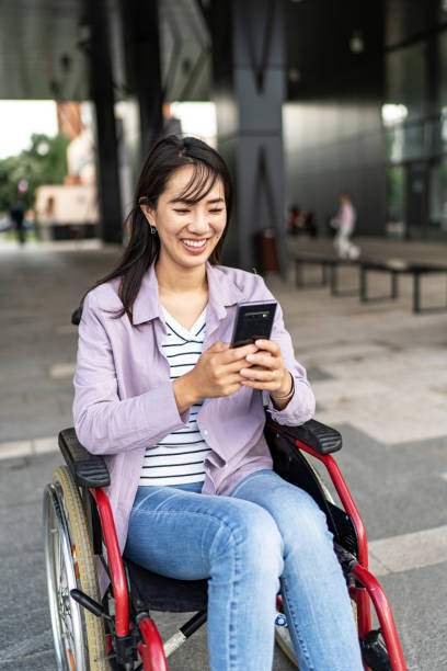 istock Casually dressed young Asian woman in wheelchair 1817002008