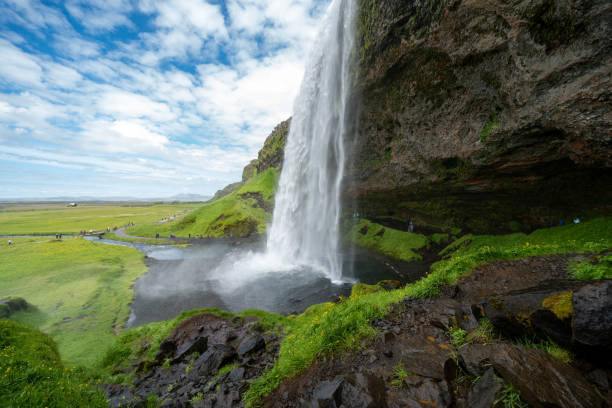 istock Seljalandsfoss waterfall in Iceland, approaching the back side of the falls 1817004222