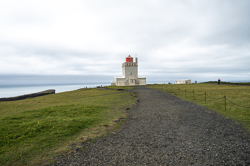 Dyrholaey lighthouse, in Iceland on an overcast cloudy day